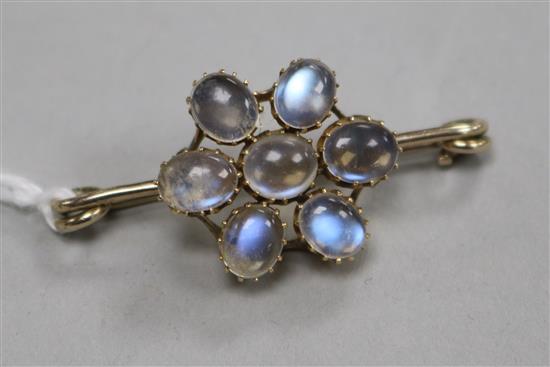 A yellow metal and moonstone cluster bar brooch, 41mm.